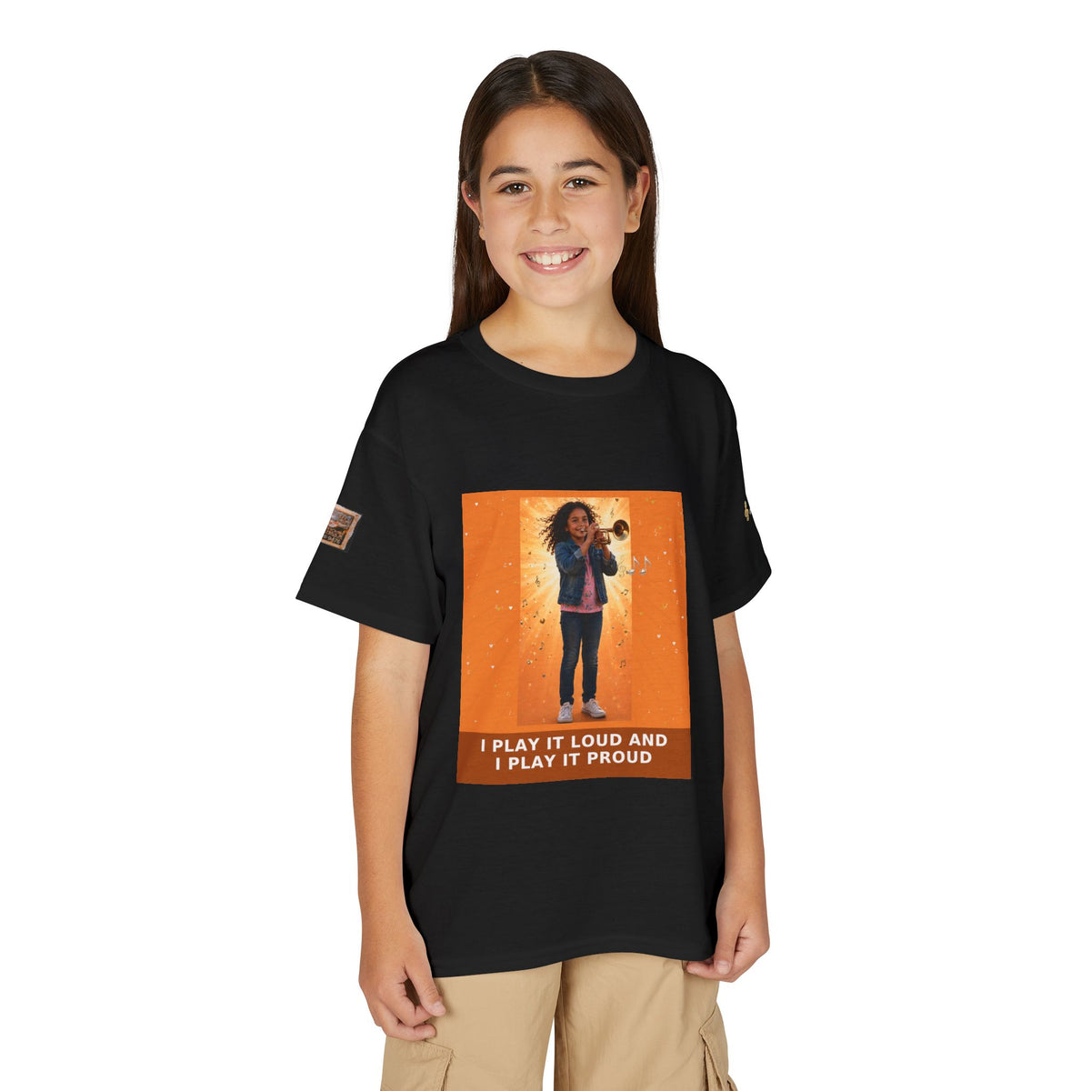 I Play It Loud and I Play It Proud — Latina Girl Trumpet Pre-Teen Musician Tee (Sunset Orange)